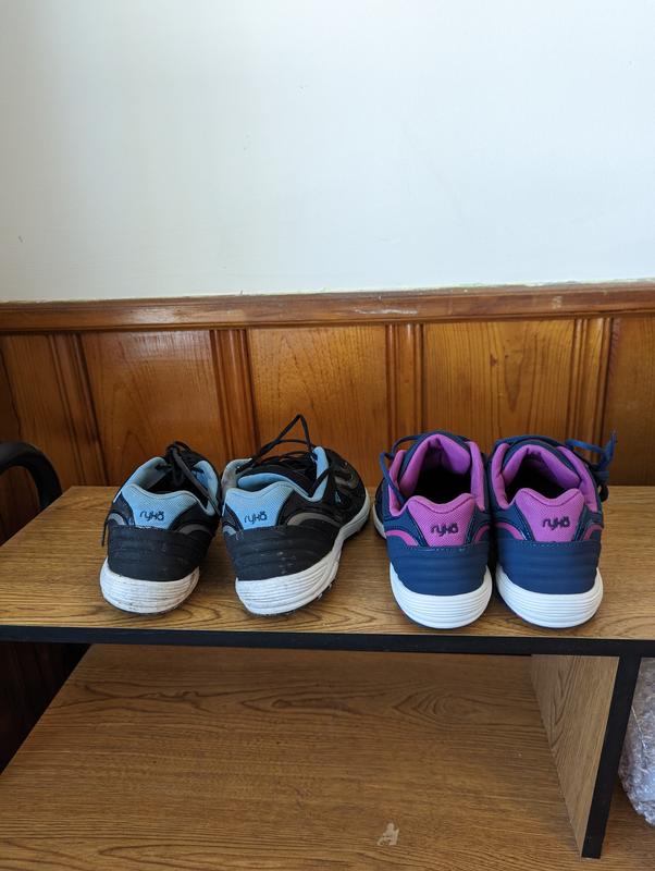 Comparison of black (defective) sneaker to blue (good pair). Side, rear and inside views of left and right sneaker.