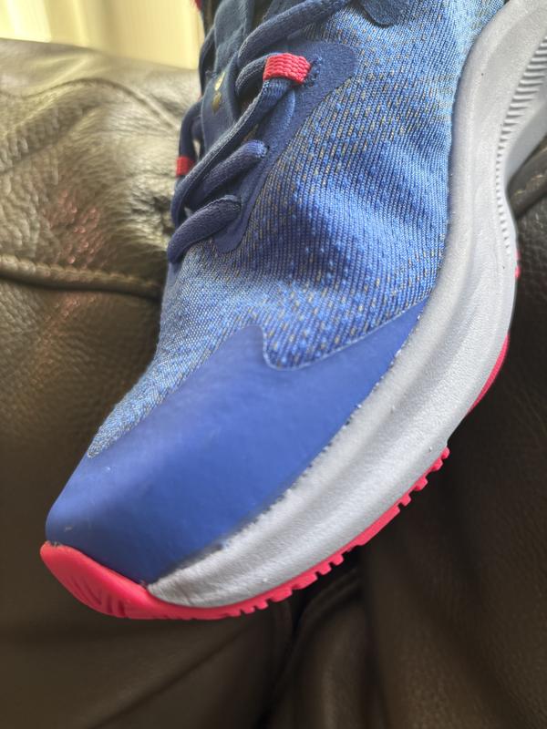 Customer photo for "Adhesive marks on sides of both sneakers"