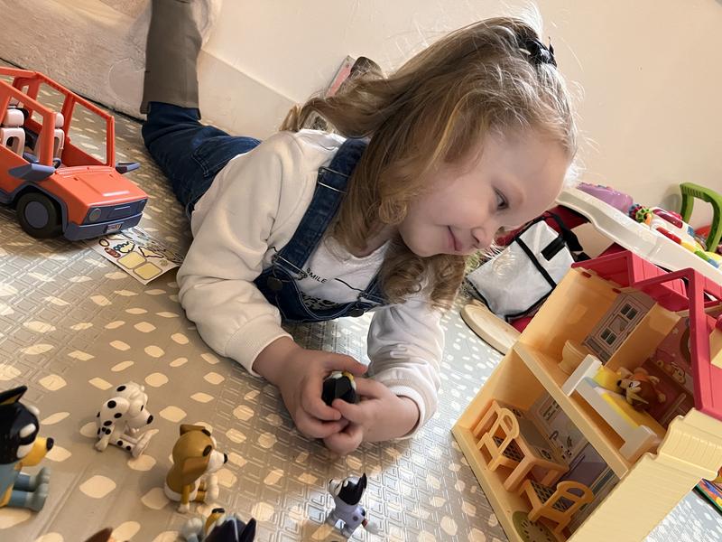 Super happy with her toy