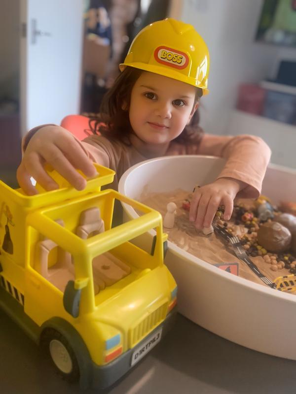 Loving her bluey dump truck