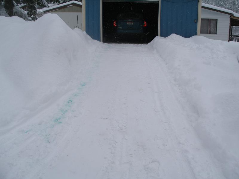Not perfect, but drivable. There is about a foot packed snow. The berm to the left is to keep the county guys from covering most of my driveway. It is 4 feet high.