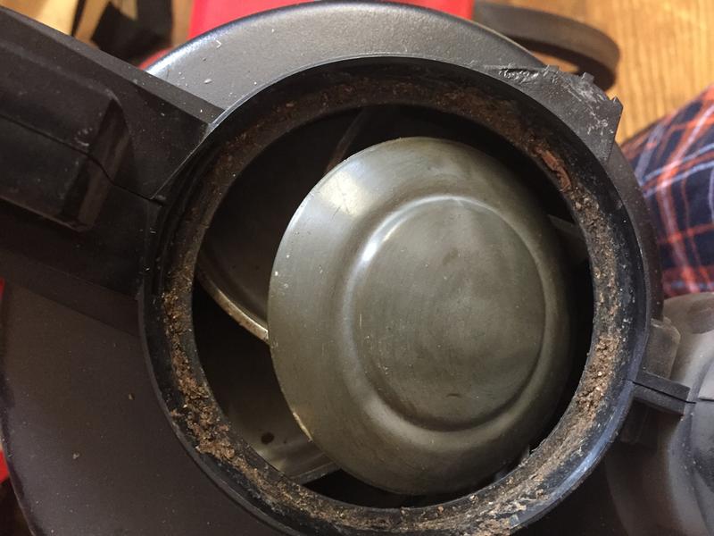 Dislodged plastic cap on a metal impeller