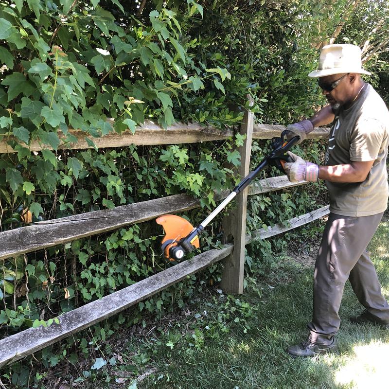 Me using my trimmer edger to cut excess bushes. No problem eating through the limbs.