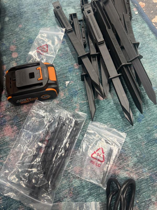 Accessories - battery, pins for charging pad, stakes for no-go boarder, extra blades, etc
