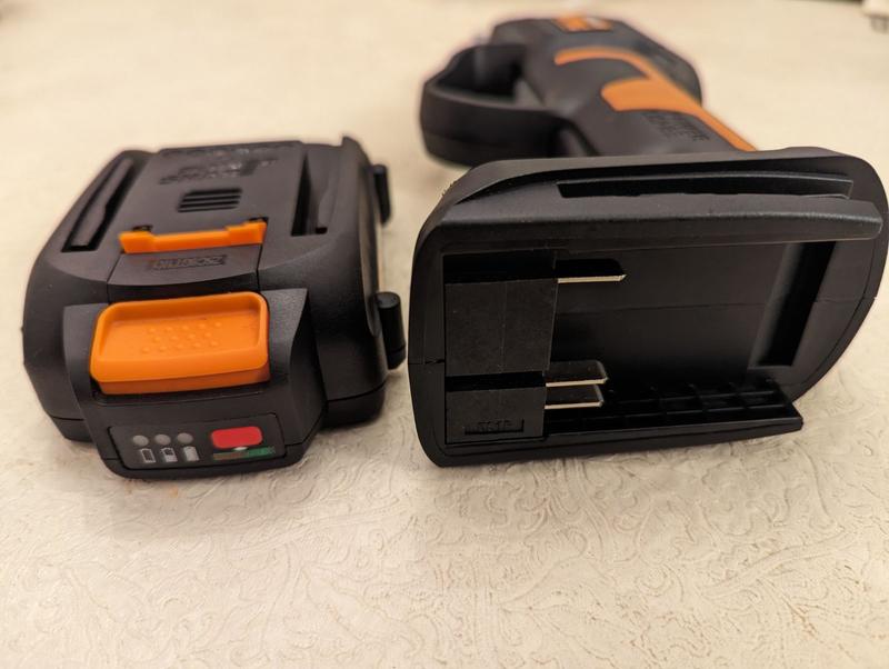 Battery slips on base and clicks in place
