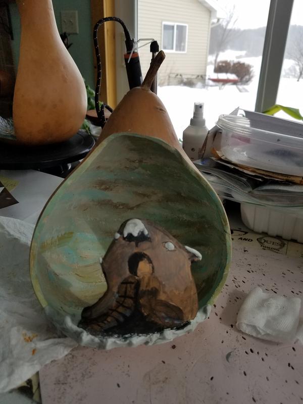 My otter, now to finish painting it, Oh my look at that snow.  Another home grown Gourd!