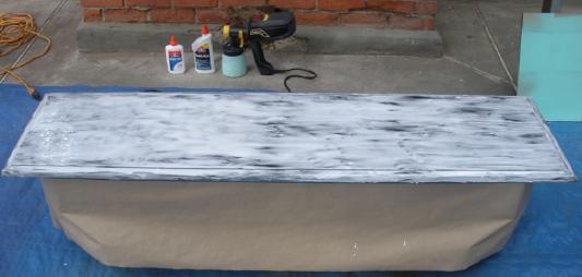 Table top smeared in all purpose PVA glue ready for painting