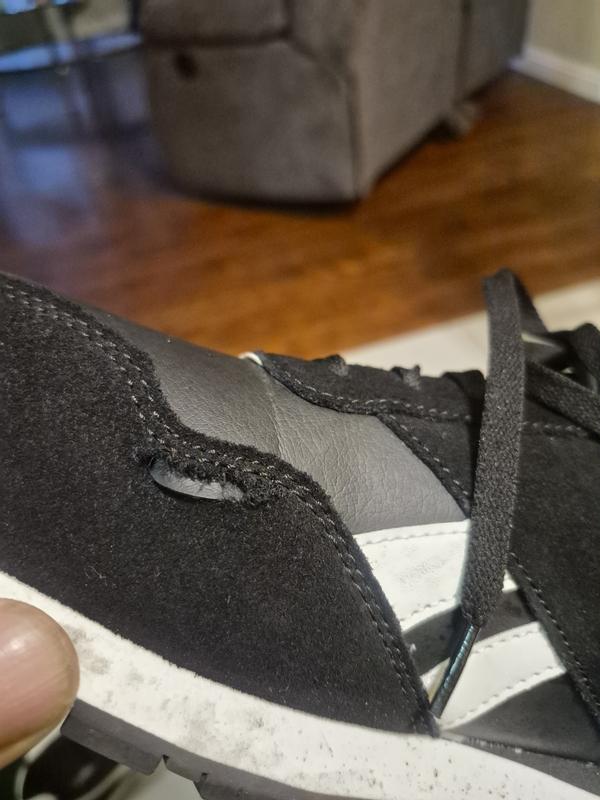 Rip in material only had shoes 2 days