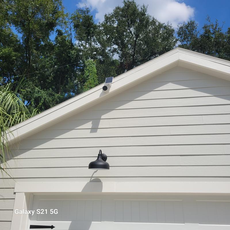 Solar Panel mounted above and south of the camera to shade the lens to cut glare in the evenings. Wiring ran underneath metal flashing and back to camera.