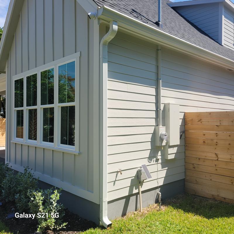 solar mounted low to outside of Fiber box, tucked wires underneath siding and ran up the side of gutter to camera.