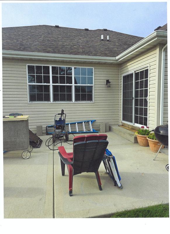 Bill finishing the back patio area of the house.  You can see the sprayer did an outstanding job of cleaning our house, we are very pleased.