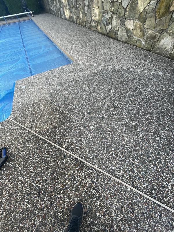 Pool deck half washed.
