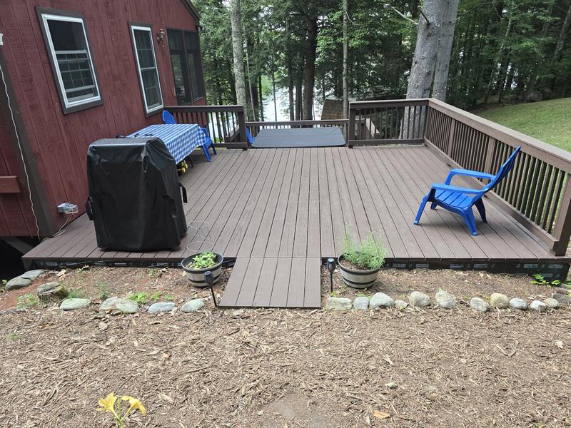 Larger of the two decks after sealing with a solid stain.