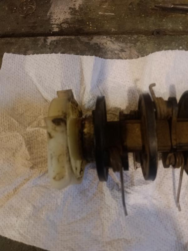 Westinghouse W13ADAC dethatcher roller with plastic attachment to housing (left)