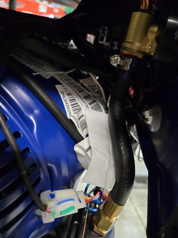 Entire sheet of stickers (plus the sheet) crammed behind the control panel