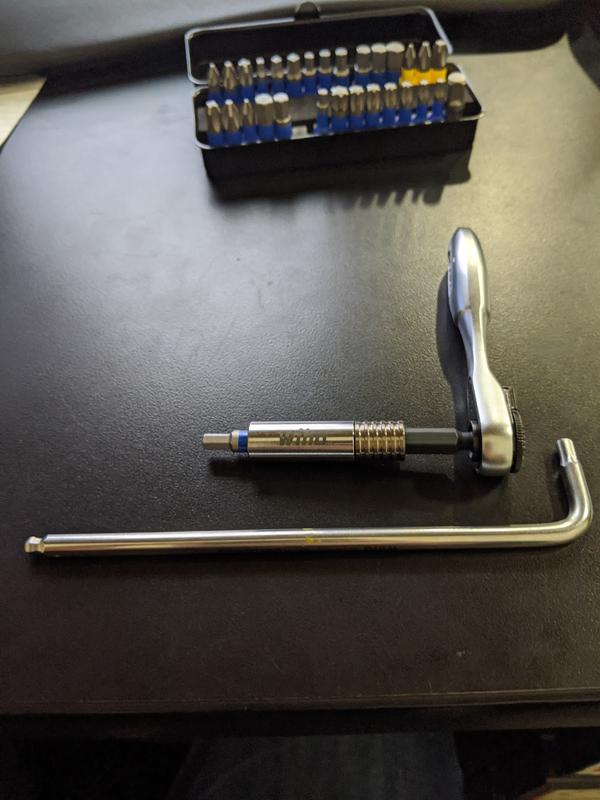 4mm hex key bit in holder and ratchet. Not as long but much more leverage with the ratchet handle.