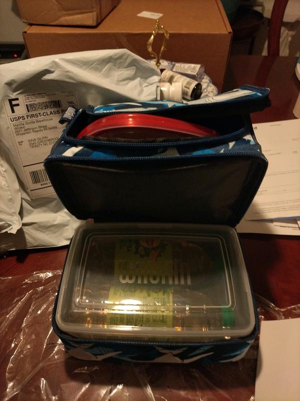 Comes with a container in the bottom compartment.