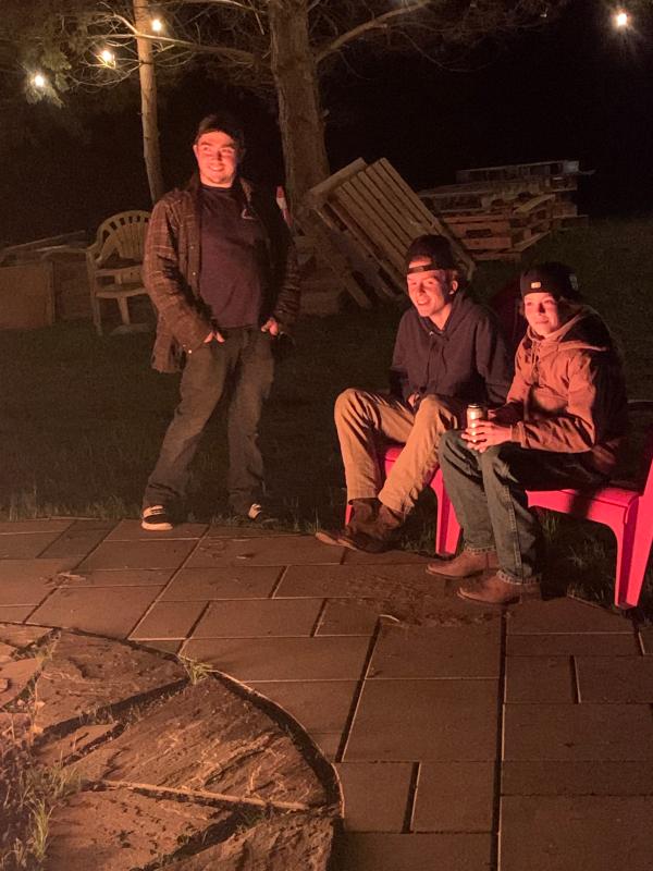 Boy sitting down far right