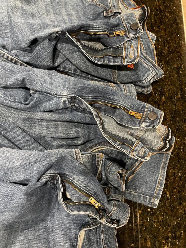 Broken zippers due to teeth failures on two and one fell off the track and is stuck.