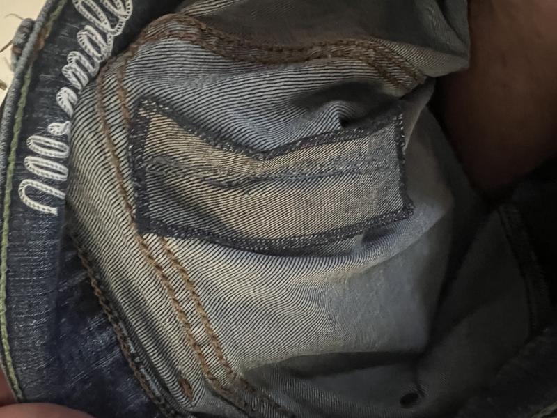 One of the ripped jeans and the consequential repair.
