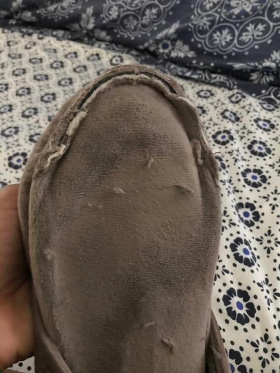 The stitching I feel around both feet with my toes