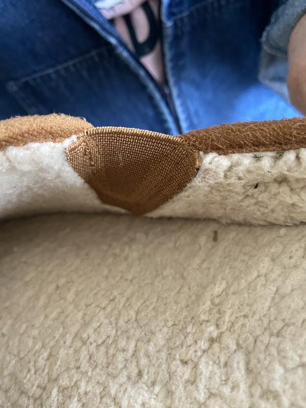 elastic raw edge rubs on side of foot