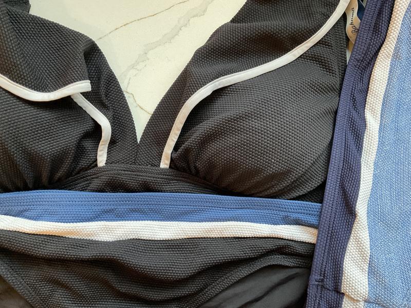 You can see that all of the other whites have remained bright except for the piping.  Big disappointment in my favorite top :(