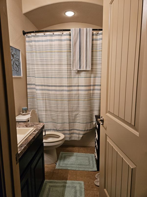Tommy Bahama shower curtain, towel, and floor mats