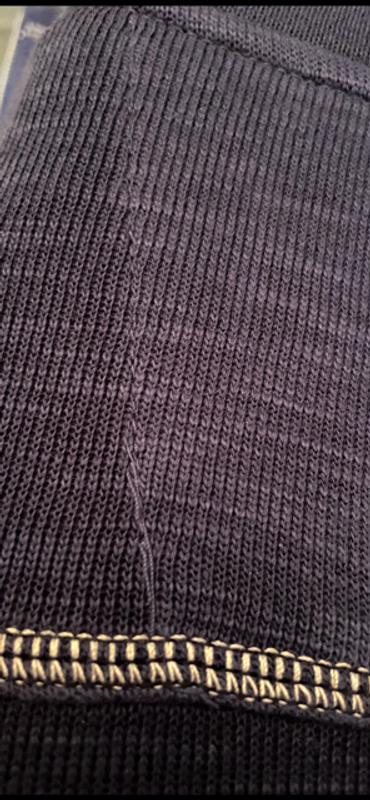 Customer photo for "Threads on the back top unacceptable."