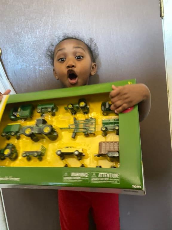 Super excited to play with her new toys.