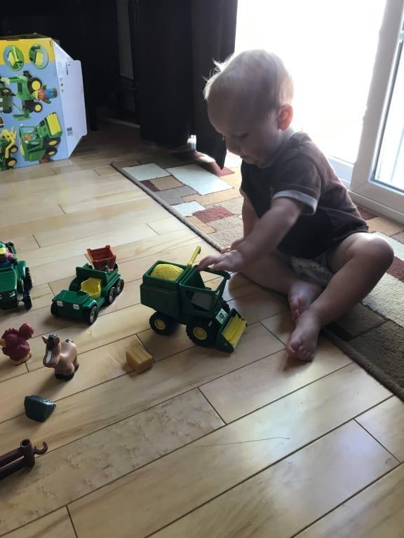 Playing with his new John deer playset