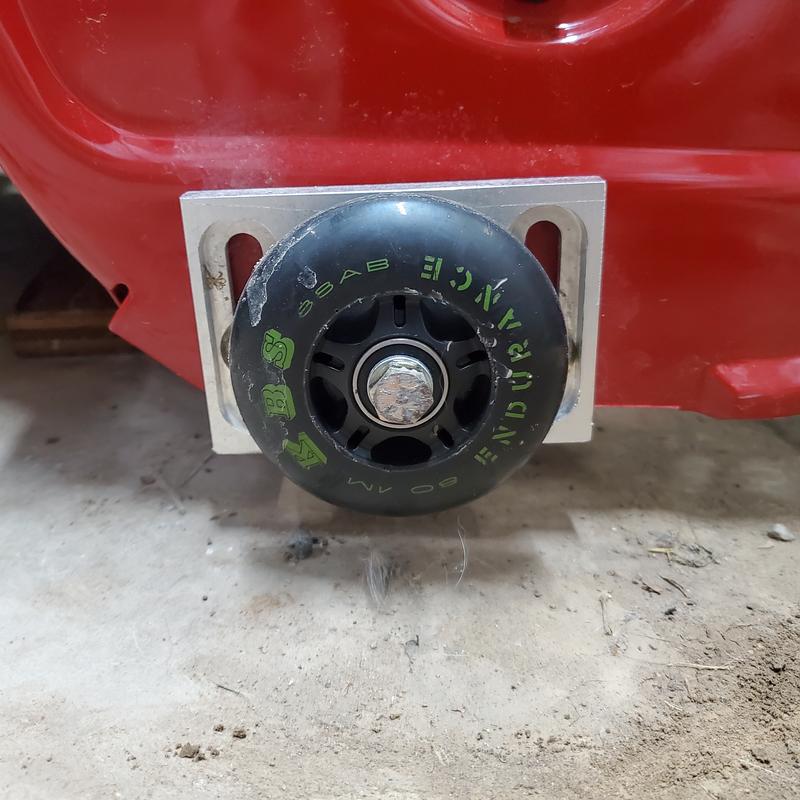 Skateboard wheel replacement for front skid plates to eliminate scratching wooden deck