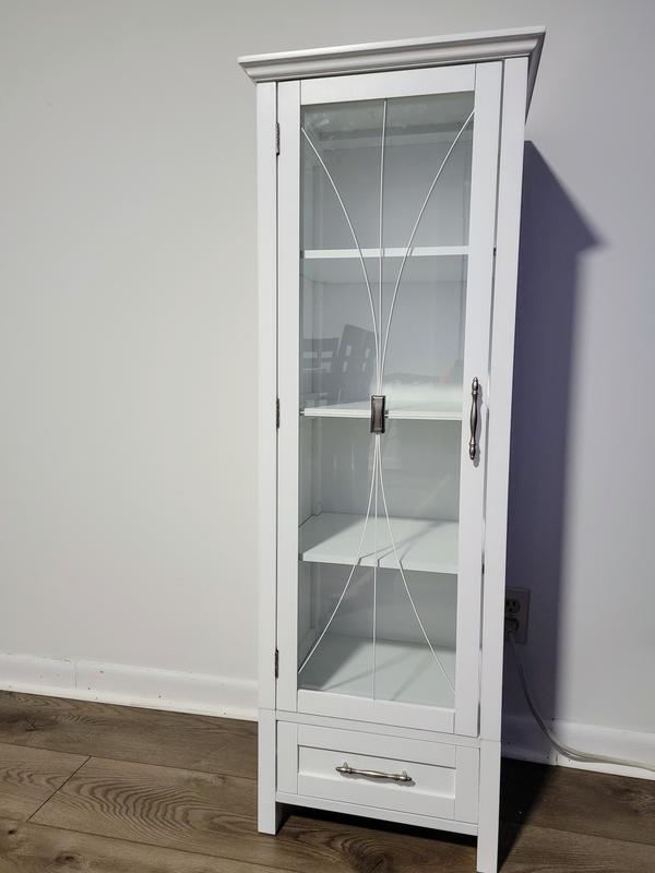 Wall cabinet with glass door and bottom drawer.