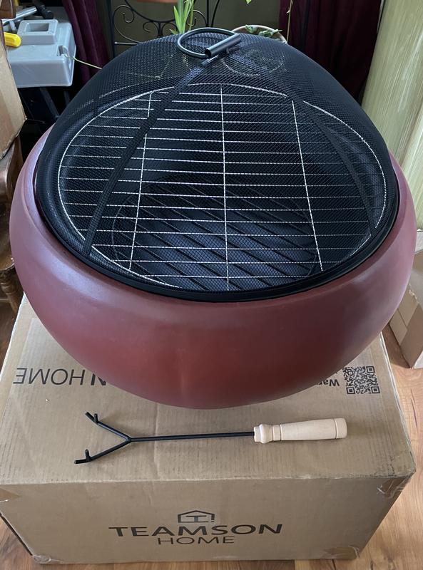 Fire pit with the charcoal grill