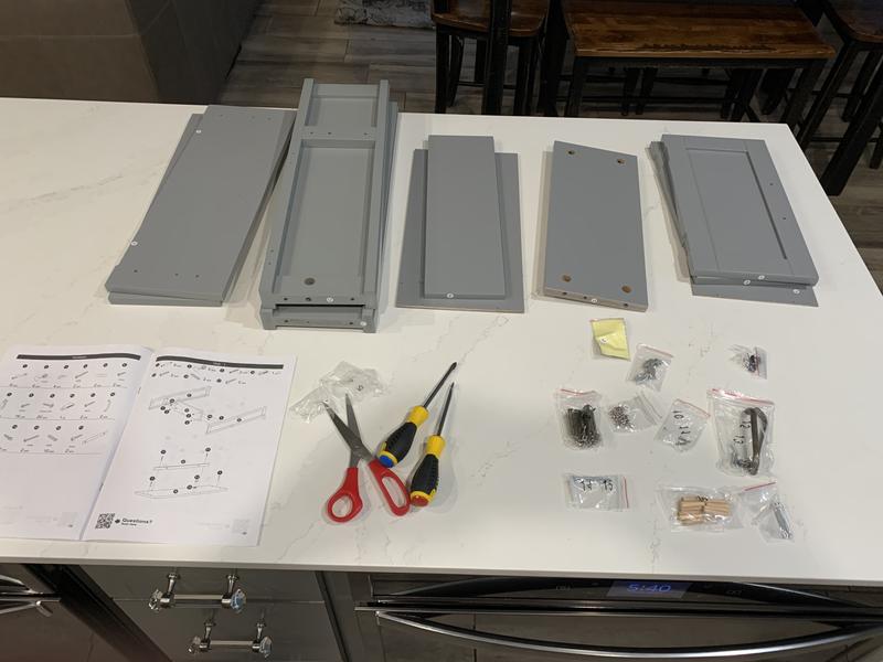 Parts and instructions for the Teamson Home Mercer Mid Century Modern wall cabinet.