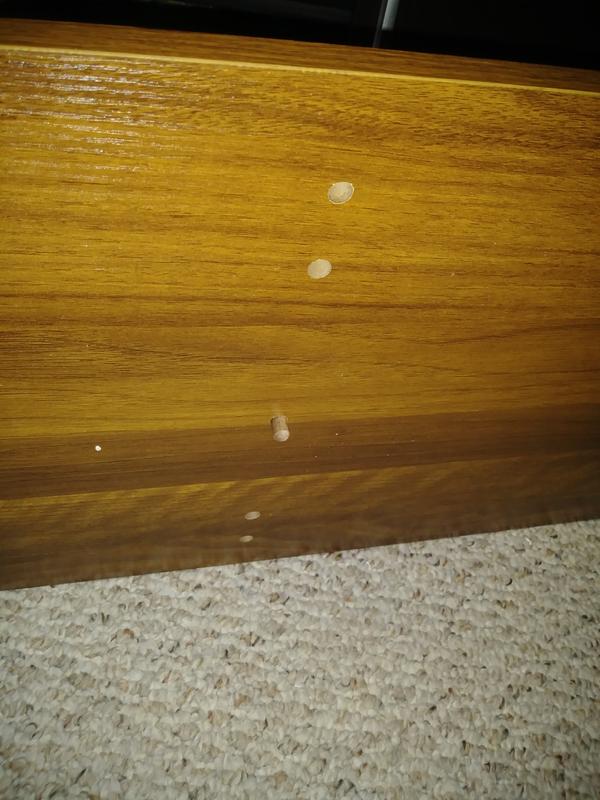 Shown is the bottom of the bottom board where the wooden peg has fallen through