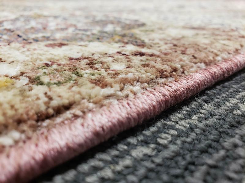 You can see the "tightness" with no loose strings. My cats have destroyed many synthetic rugs that start off with looser threading that more closely resembles a bath towel.