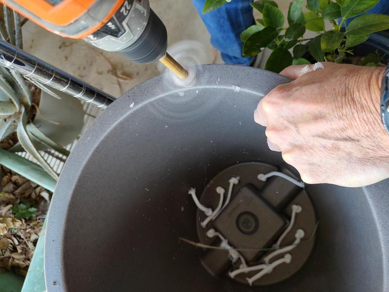 Drill the top hole large enough to allow you to funnel the 10 gallons of water in- 3/8" here worked.