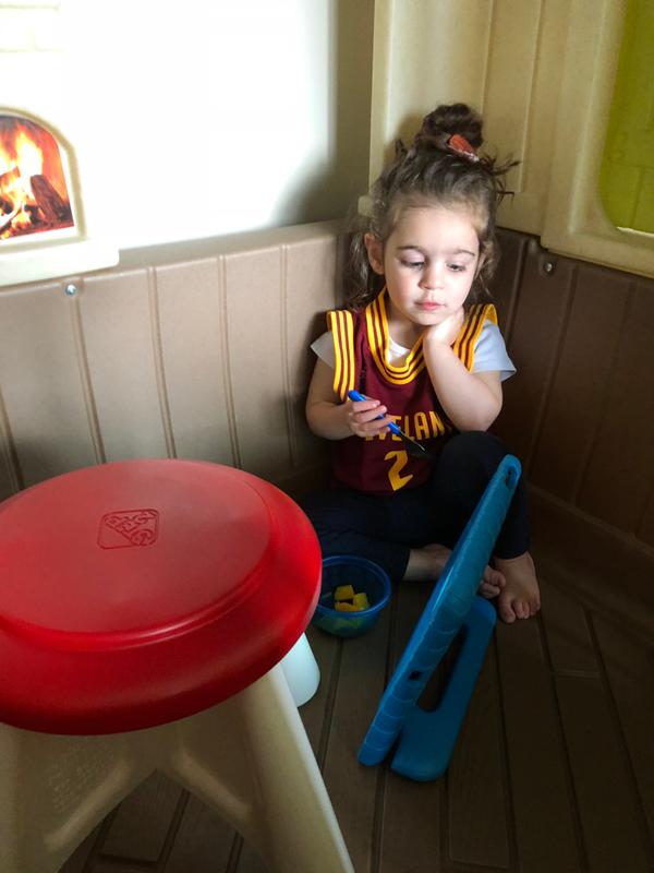 My daughter eating in the house