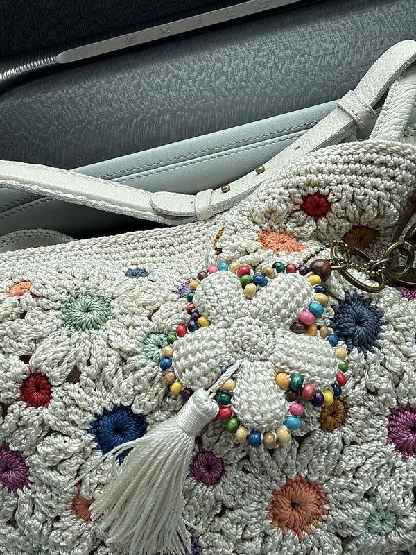 Customer photo for "Love this bag charm with"