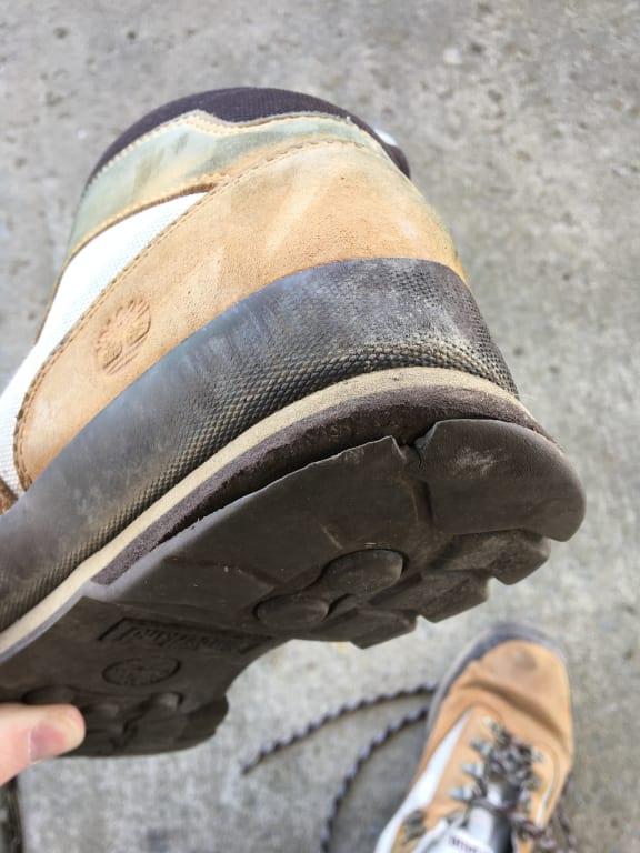 The outsole peeling away from the boot