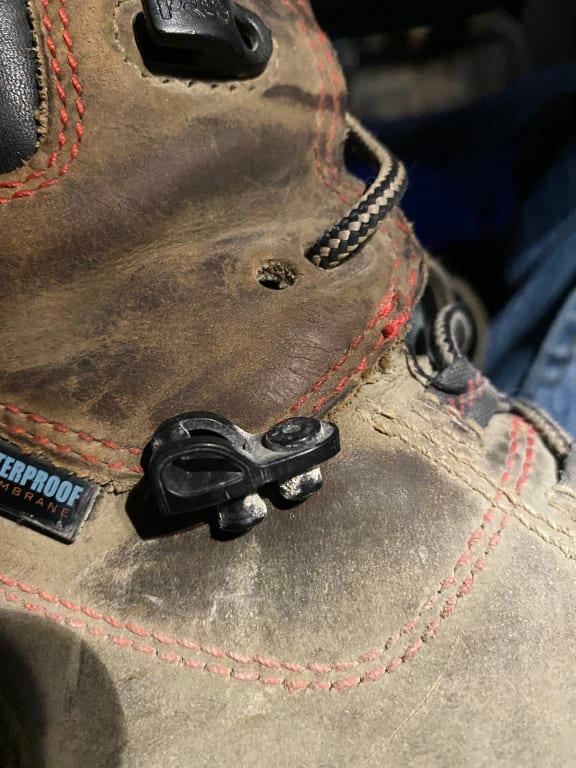 Plastic grommet completely seperated from boot had to feed lace through hole to continue wearing the boot