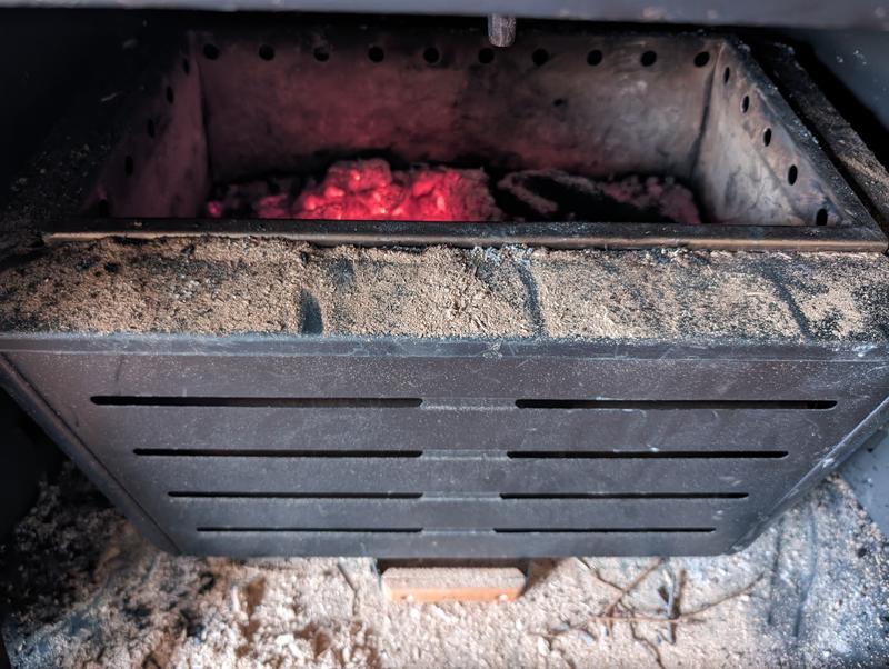 4 inches of black unburnt loose sawdust.. UGH!!