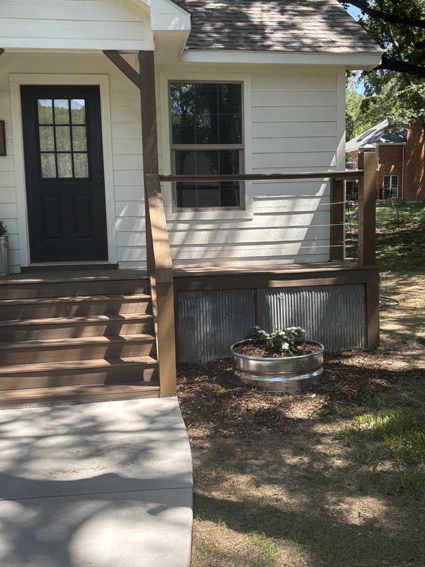 Planters in front of a guest cottage at venue Harvest Field Farm