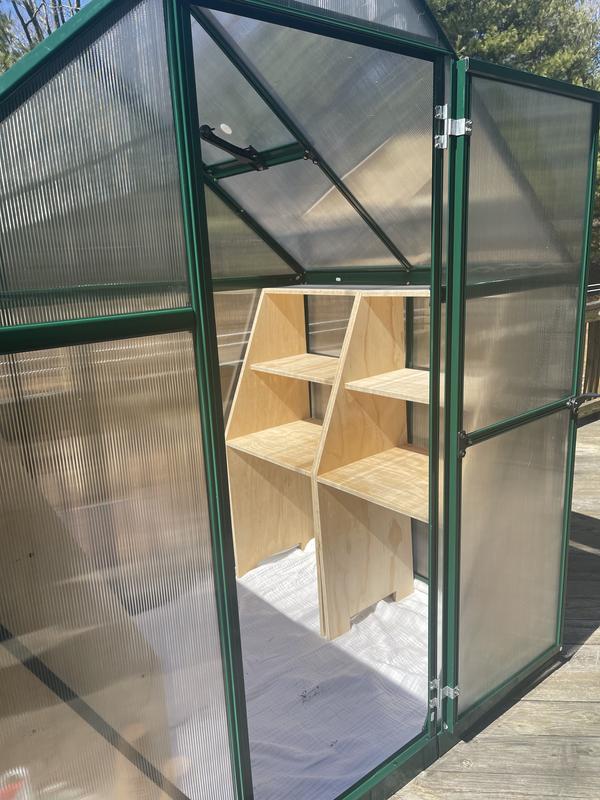Shelves fit nicely at each side of the greenhouse.