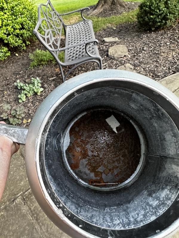 Inside of watering can shown. Notice rust doesn’t go to the edges and there’s also a weird area that is not rusted that looks like a piece of tape was there.