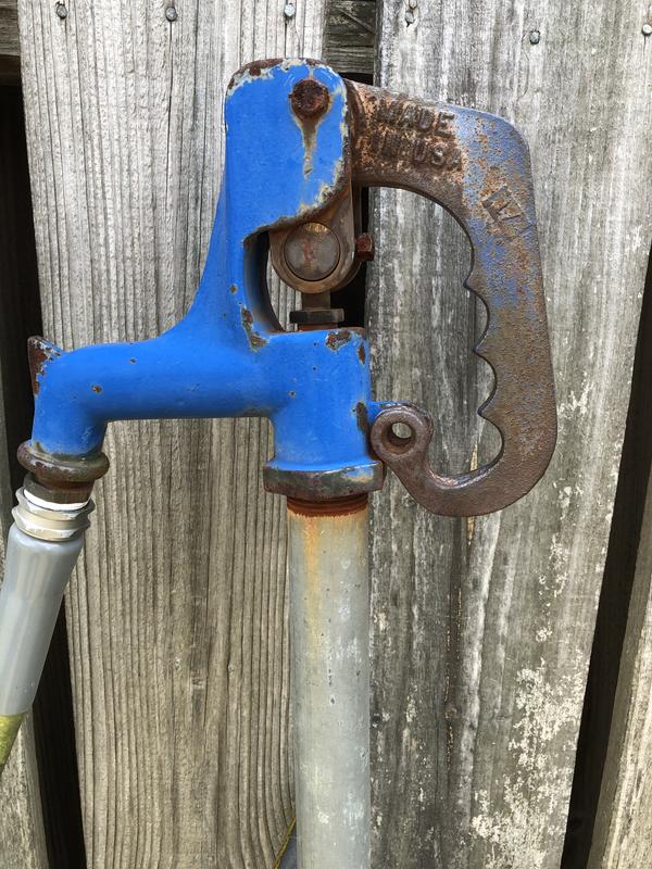 New one is the black handle. Old one is the blue one.