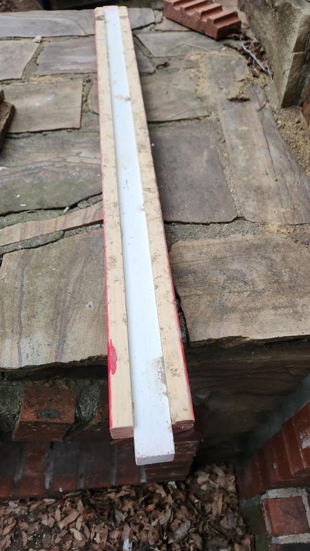 The white in the middle is the original roosting bar.  I added a 1x2 to each side to give proper width for a chicken.