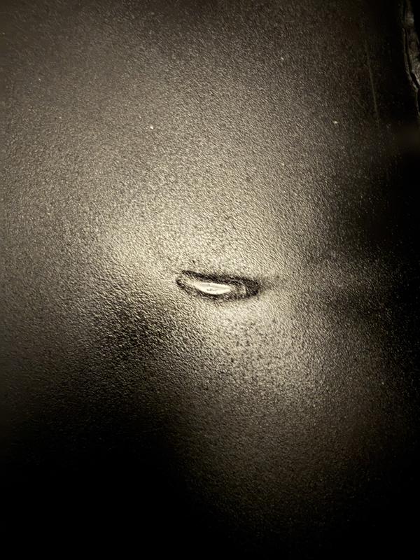 Dent on bottom plate, making it wobbly.