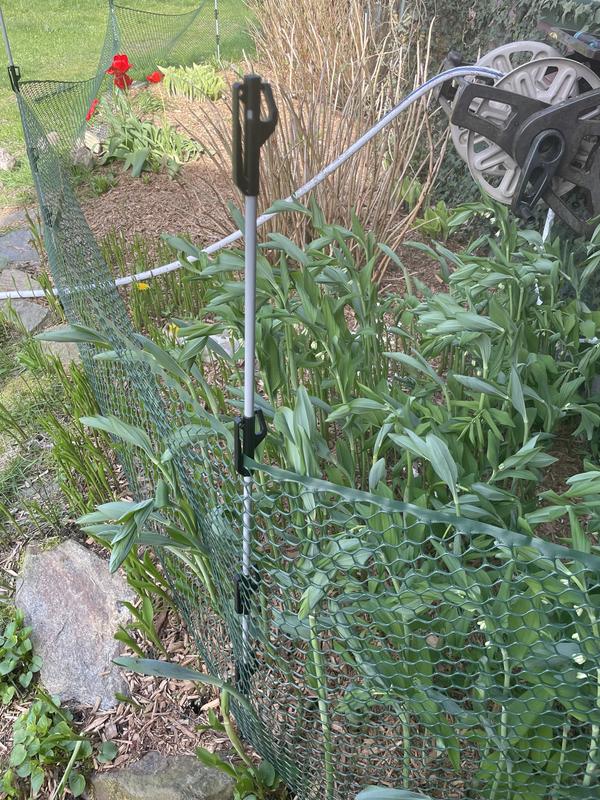 My makeshift round pen and an attempt at keeping the dogs out of my flowerbeds.